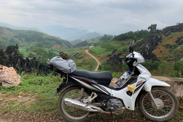 Motorbike parked on a mountain road in Ha Giang