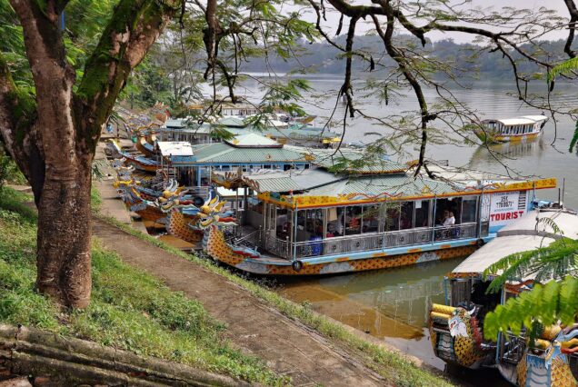 Vietnamese dragon boat operating as a tourist vessel on the Perfume River in Huế, Vietnam