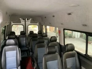 Inside a private 16-seat minivan