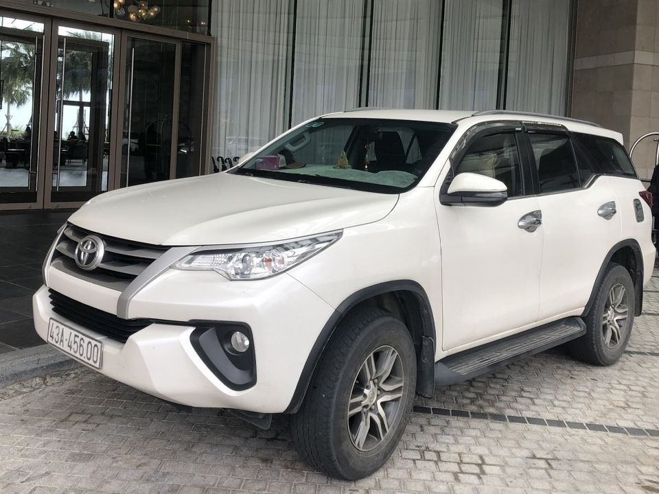 Private 7-seat car with driver waiting at a hotel in Vietnam